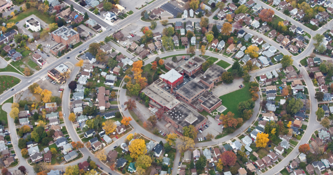 An aerial view of a neighbourhood surrounding a large church